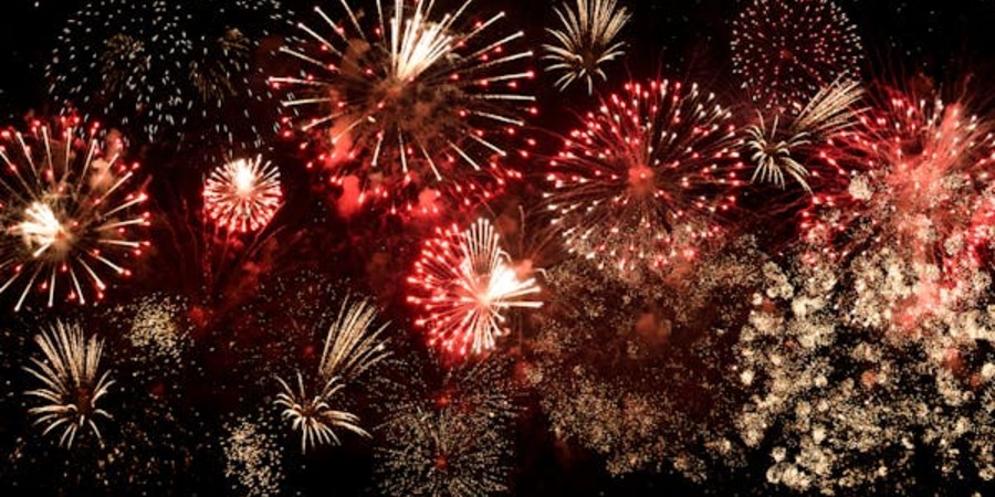 Colorful fireworks lighting up the night sky at a Calgary festival event.